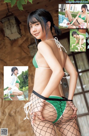 A woman in a green bikini and fishnet stockings posing for a picture.