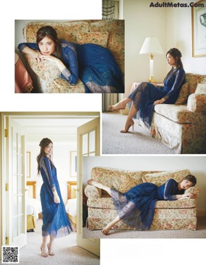 A woman laying on top of a couch next to a pillow.