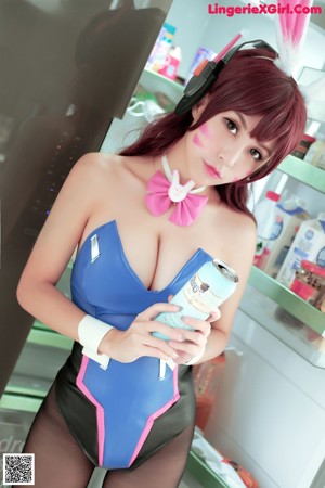 A woman in a bunny costume posing for a picture.
