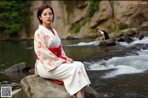 A woman in a colorful dress standing in the woods.