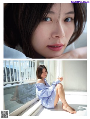 A woman in a blue sweater sitting on a wooden bench.