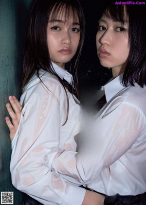 A couple of women in lingersuits standing next to each other.